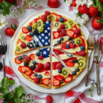 American Flag Fruit Pizza: A Delightful Patriotic Treat! 8 American flag fruit pizza with strawberries and blueberries on cookie crust